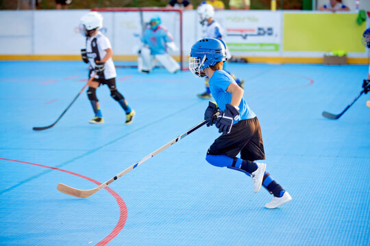 Team players having competitive hockey game