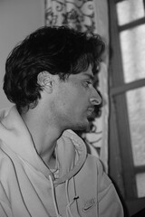 Moody black and white portrait of a young Kashmiri Gen Z boy, capturing raw emotion, identity, and...