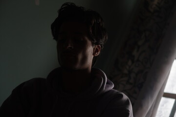 Color portrait of a young Kashmiri Gen Z boy, capturing the essence of modern youth with quiet...