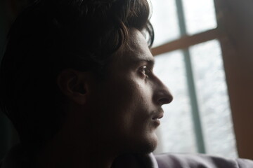 Color portrait of a young Kashmiri Gen Z boy, capturing the essence of modern youth with quiet...