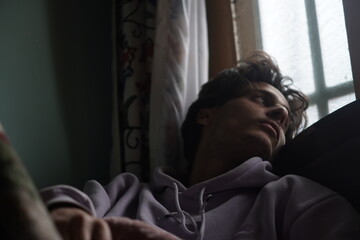 Color portrait of a young Kashmiri Gen Z boy, capturing the essence of modern youth with quiet...