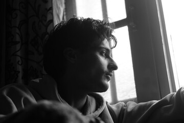 Moody black and white portrait of a young Kashmiri Gen Z boy, capturing raw emotion, identity, and...