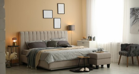 Comfortable bed with soft linens and blankets in room. Home textile