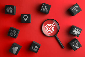 Targeting, business strategy, planning. Magnifying glass with bullseye and black cubes with...