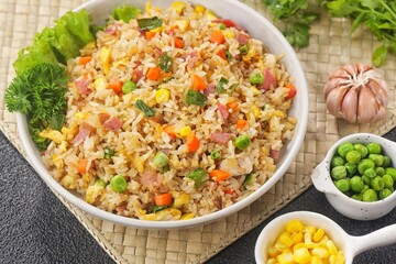 Nasi Goreng Hongkong. Chinese Fried rice is a dish of cooked rice that has been stir-fried in a wok or a frying pan and is usually mixed with other ingredients such as eggs, vegetables, seafood, or me