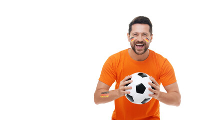 Excited fan with flags of Germany painted on his body holding soccer ball against white background....
