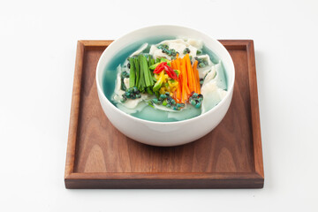  Handmade noodles boiled with tea leaves.