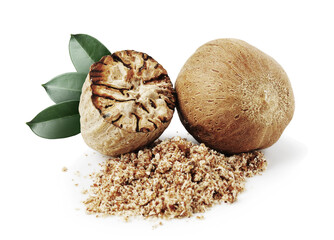 Nutmeg seeds with green leaves on white background. Aromatic spice