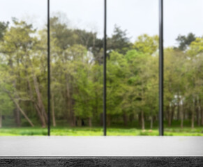 Empty stone table against window in room