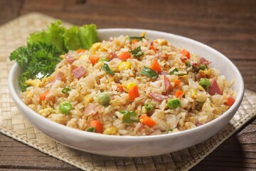 Nasi goreng Hongkong. Chinese Fried rice is a dish of cooked rice that has been stir-fried in a wok or a frying pan and is with other ingredients such as eggs, vegetables, seafood, or meat
