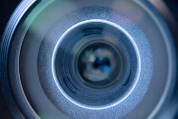 Camera lens close-up, professional Photography camera lens with warm light reflections.