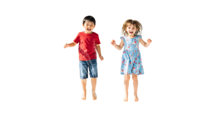 Two people jumping over a sprinkler