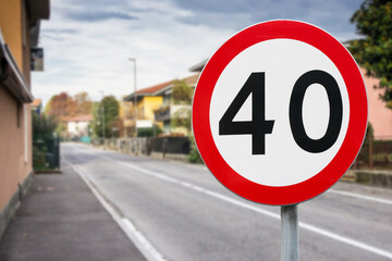 Speed limit road sign 40. Urban street with traffic sign. Warning symbol for drivers. Residential...