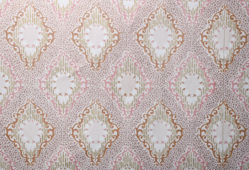 Old wallpaper on the wall. Old wallpaper for texture or background.