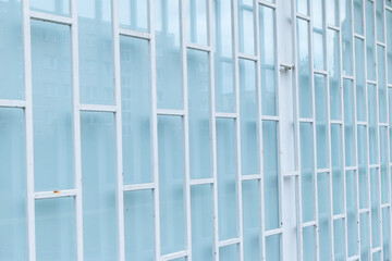 Metal grid with a rectangular geometric pattern against frosted glass.
