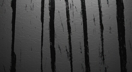 Closeup of textured gray surface with irregular dark vertical streaks