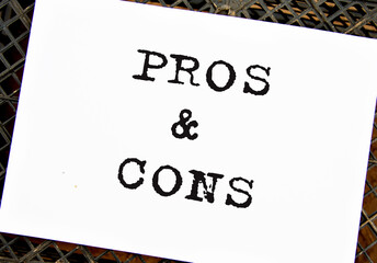 PROS and CONS - words on white sheet on black grid background