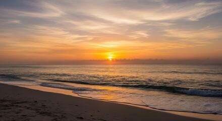 Serene Ocean Sunrise Over Sandy Beach With Gentle Waves and Wispy Clouds