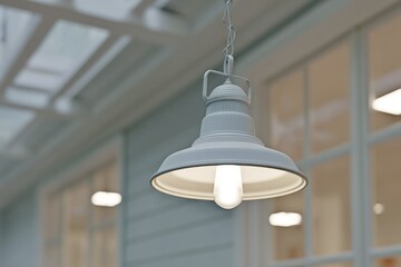 Elegant white hanging light fixture illuminating indoor space with modern design elements and soft ambiance
