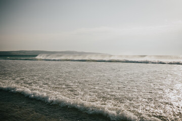 The ocean is calm and the sky is clear