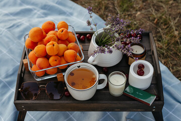 A tea tray with apricots and lavender