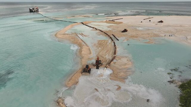 Aerial view of barge and construction equipment, Maldives.