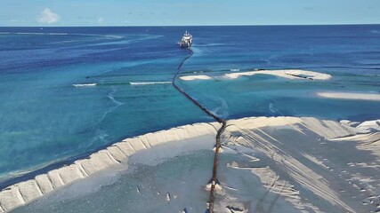 Aerial view of dredging operation in ocean, Maldives.