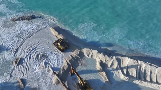 Aerial view of construction equipment on reclaimed land, Maldives.
