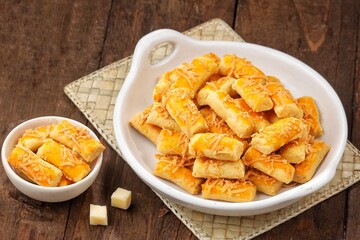 Kue Kastengel. Kaasstengels (Dutch, kaas, cheese; stengel, stem) are pastries made from a mixture of wheat flour, eggs, margarine and grated cheese.