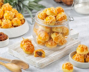 Nastar Keju is a type of pastry made from a mixture of wheat flour, butter and eggs filled with pineapple jam or chocolate and other flavors.