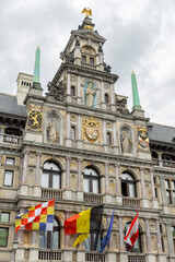 the Belgium, European union, Antwerp flags on the city hall front facade