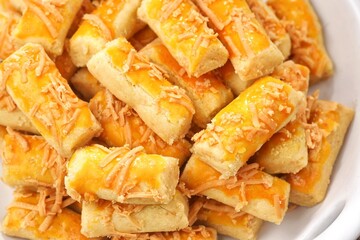 Kue Kastengel. Kaasstengels (Dutch, kaas, cheese; stengel, stem) are pastries made from a mixture of wheat flour, eggs, margarine and grated cheese.