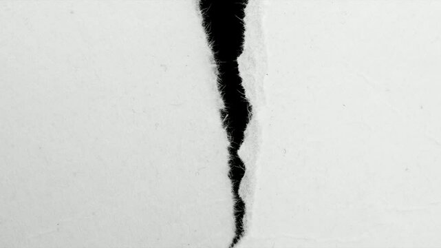 a white piece of paper on a black isolated background