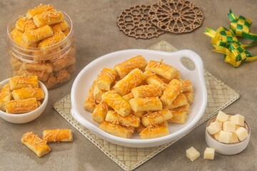 Kue Kastengel. Kaasstengels (Dutch, kaas, cheese; stengel, stem) are pastries made from a mixture of wheat flour, eggs, margarine and grated cheese.