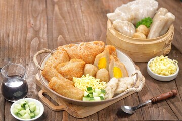 Pempek or mpek-mpek is a delicacy from Palembang, South Sumatra. It is made of fish and sago flours and served together with a dark, rich sauce called cuko.