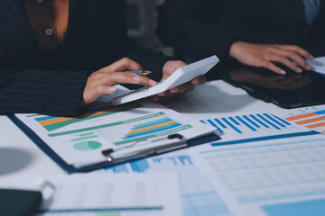Two business people analyzing the data