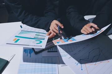 Two business people analyzing the data