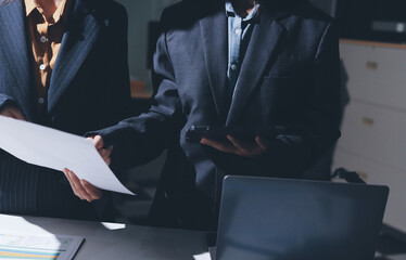 Two business people analyzing the data