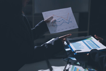 Group of business women working on a financial data expenses document.