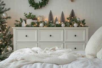 White wooden dresser with seven drawers in bright room, decorated with Christmas ornaments, minimalist holiday interior design