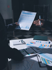 Group of business women working on a financial data expenses document.