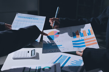 Group of business women working on a financial data expenses document.