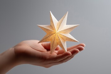 Woman holding glowing christmas star in open hand