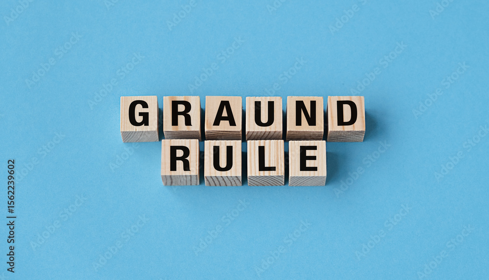 Poster a wooden block with the letters grand rule written on it