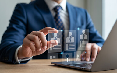 Human resource professional reviewing potential candidates using a digital interface on a laptop for recruitment and hiring.