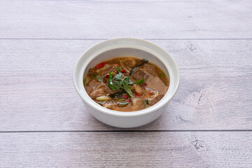 Spicy pork ribs soup in a white bowl