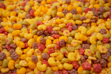 Sweet crunchy cornflakes as a background. Top view.
