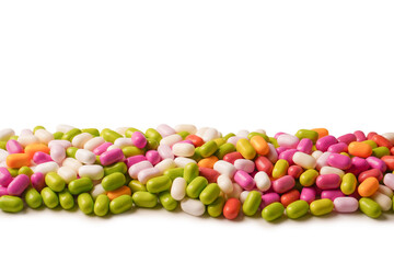 Sweet multicolored candies isolated on white background.