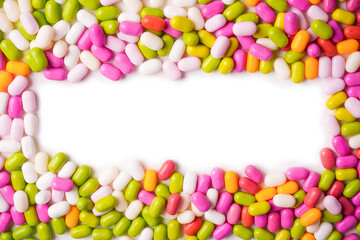 Sweet multicolored candies isolated on white background.