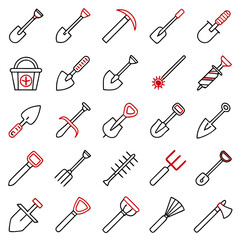 Collection of gardening and digging tools including shovels, rakes, axes, and other agricultural implements